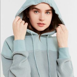 out from under teal hoodie